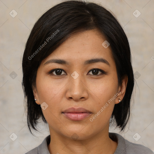 Joyful asian young-adult female with medium  black hair and brown eyes