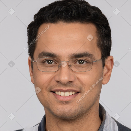 Joyful white young-adult male with short  black hair and brown eyes