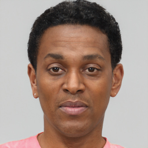 Neutral black adult male with short  black hair and brown eyes