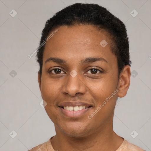 Joyful black young-adult female with short  brown hair and brown eyes