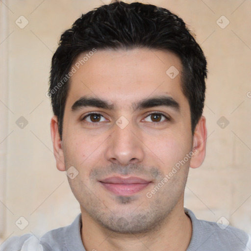 Joyful white young-adult male with short  black hair and brown eyes