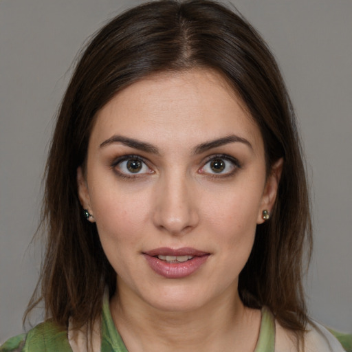 Joyful white young-adult female with medium  brown hair and brown eyes