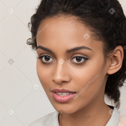 Joyful latino young-adult female with long  brown hair and brown eyes