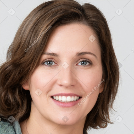 Joyful white young-adult female with medium  brown hair and green eyes