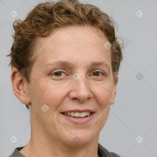 Joyful white adult female with short  brown hair and grey eyes