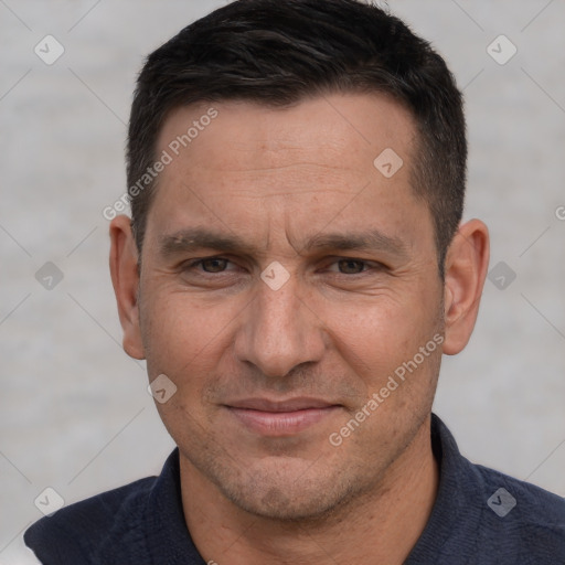 Joyful white adult male with short  brown hair and brown eyes