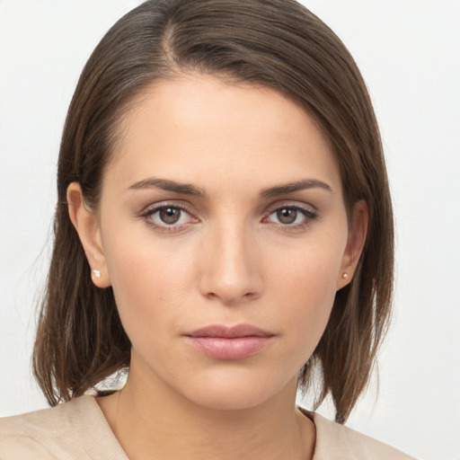 Neutral white young-adult female with medium  brown hair and brown eyes