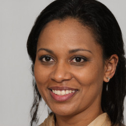 Joyful black young-adult female with medium  brown hair and brown eyes