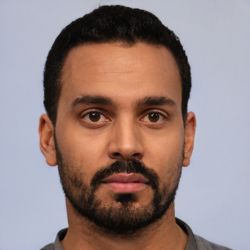 Neutral latino young-adult male with short  black hair and brown eyes