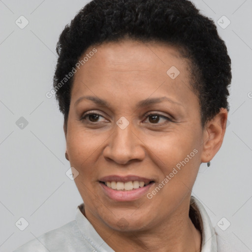 Joyful latino adult female with short  brown hair and brown eyes