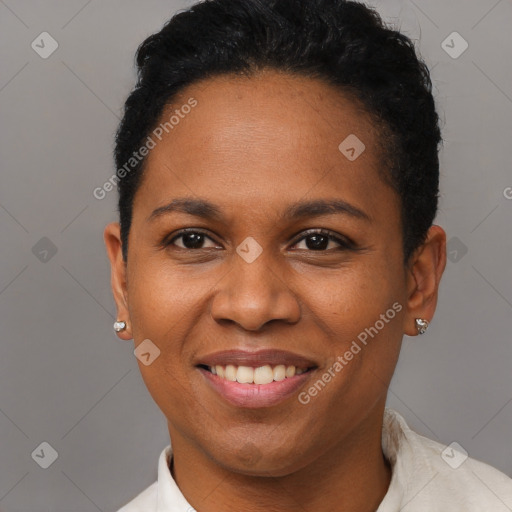 Joyful black young-adult female with short  brown hair and brown eyes