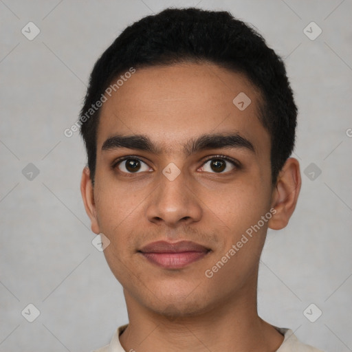 Joyful latino young-adult male with short  black hair and brown eyes