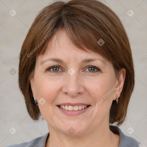 Joyful white adult female with medium  brown hair and grey eyes