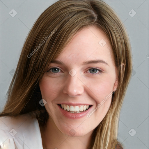 Joyful white young-adult female with long  brown hair and blue eyes