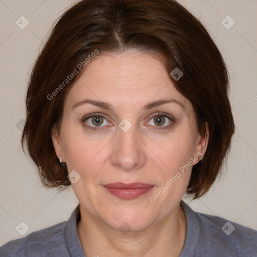 Joyful white adult female with medium  brown hair and blue eyes