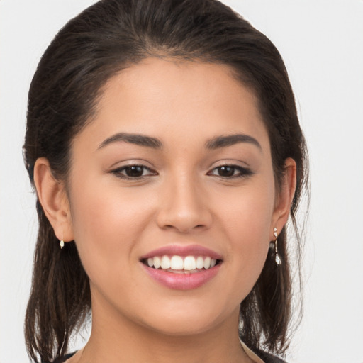 Joyful white young-adult female with medium  brown hair and brown eyes