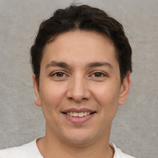 Joyful white young-adult male with short  brown hair and brown eyes