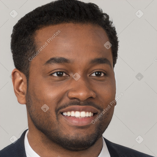 Joyful black young-adult male with short  brown hair and brown eyes