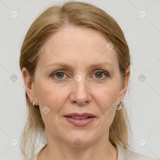 Joyful white adult female with medium  brown hair and grey eyes