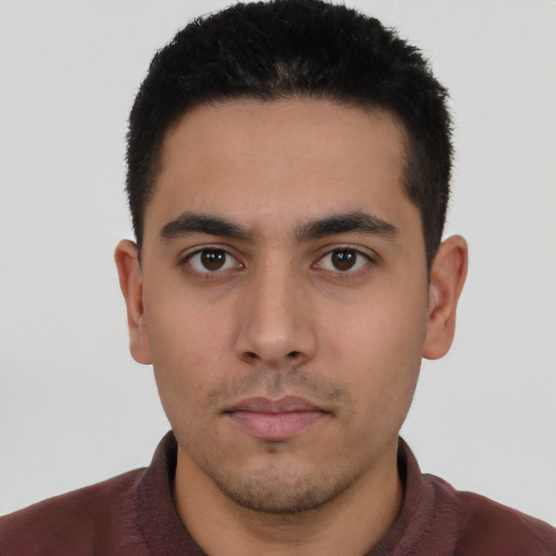 Neutral latino young-adult male with short  black hair and brown eyes