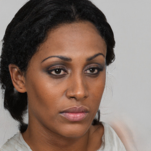 Neutral black young-adult female with medium  brown hair and brown eyes