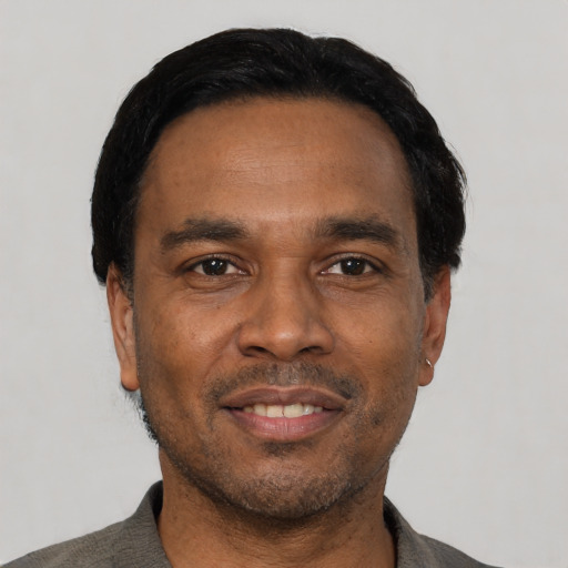 Neutral latino adult male with short  black hair and brown eyes