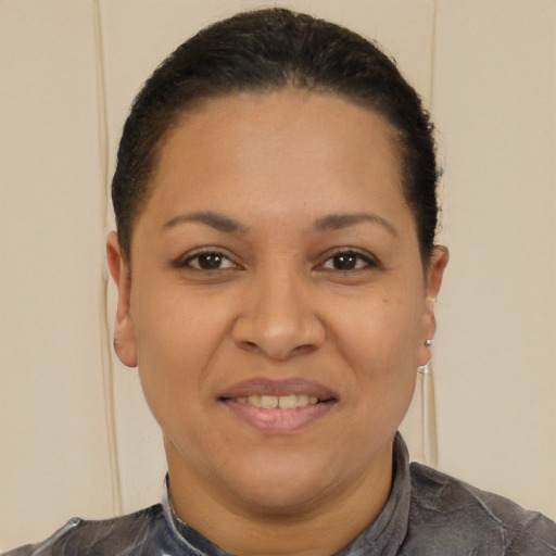 Joyful latino young-adult female with short  brown hair and brown eyes