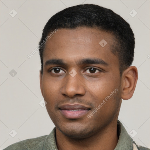 Joyful black young-adult male with short  black hair and brown eyes