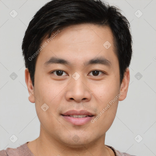 Joyful asian young-adult male with short  brown hair and brown eyes