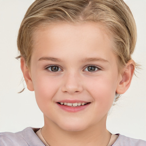 Joyful white child female with short  brown hair and brown eyes