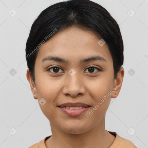 Joyful asian young-adult female with short  black hair and brown eyes