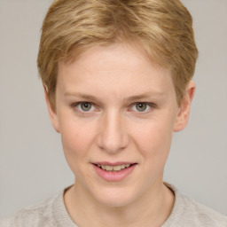 Joyful white young-adult female with short  brown hair and grey eyes