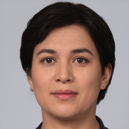 Joyful white young-adult female with short  black hair and brown eyes