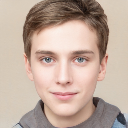 Joyful white child male with short  brown hair and grey eyes