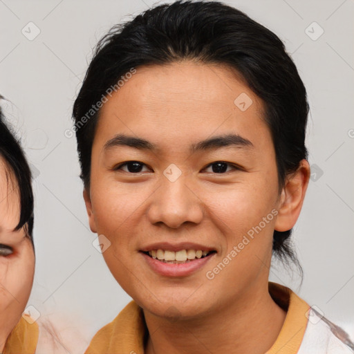 Joyful asian young-adult female with medium  brown hair and brown eyes