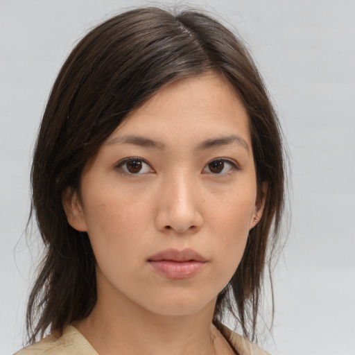 Neutral asian young-adult female with medium  brown hair and brown eyes