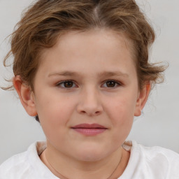 Joyful white child female with short  brown hair and brown eyes