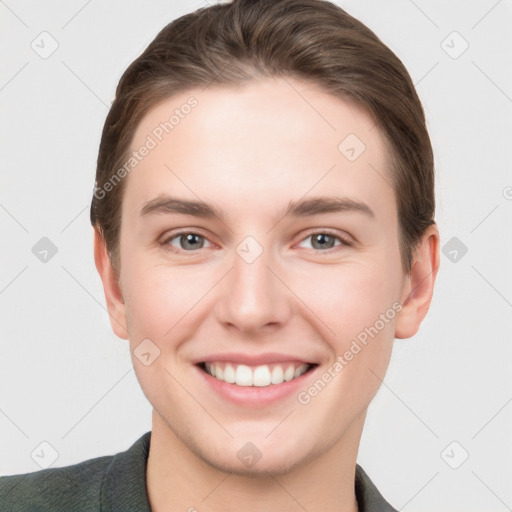 Joyful white young-adult female with short  brown hair and grey eyes