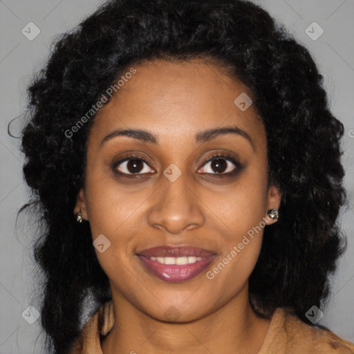 Joyful black young-adult female with long  brown hair and brown eyes