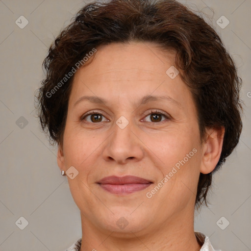 Joyful white adult female with short  brown hair and brown eyes