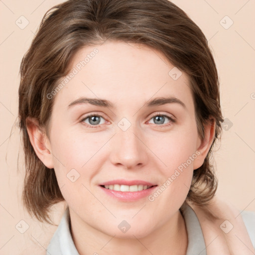 Joyful white young-adult female with medium  brown hair and blue eyes