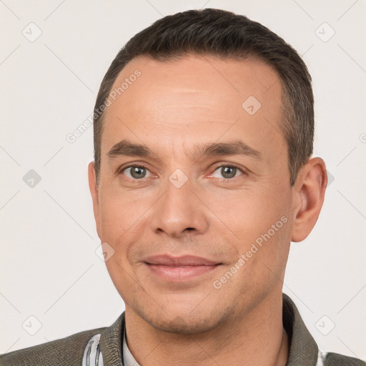 Joyful white adult male with short  brown hair and brown eyes