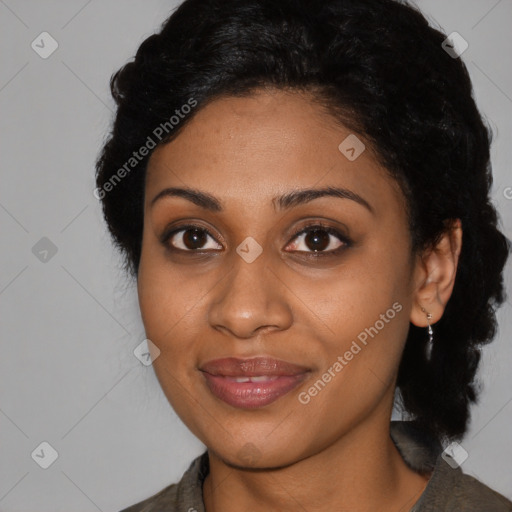 Joyful black young-adult female with medium  brown hair and brown eyes