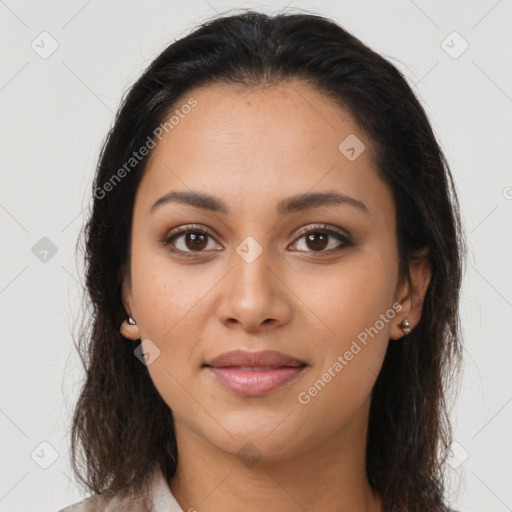 Joyful latino young-adult female with medium  brown hair and brown eyes