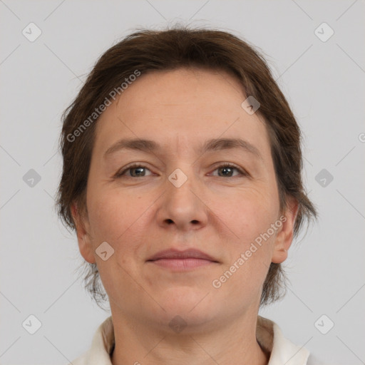 Joyful white adult female with short  brown hair and brown eyes