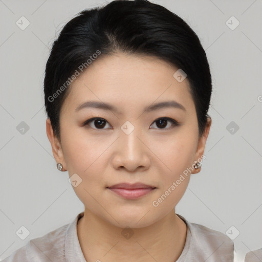 Joyful asian young-adult female with short  black hair and brown eyes