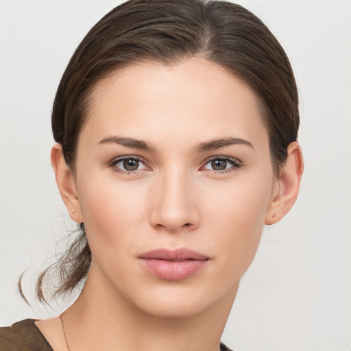 Neutral white young-adult female with medium  brown hair and brown eyes