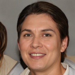 Joyful white adult female with medium  brown hair and brown eyes