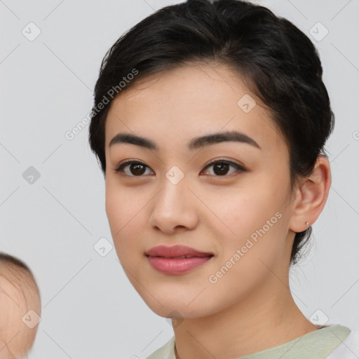 Joyful asian young-adult female with medium  black hair and brown eyes