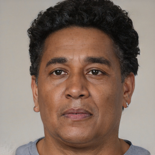 Neutral latino adult male with short  black hair and brown eyes